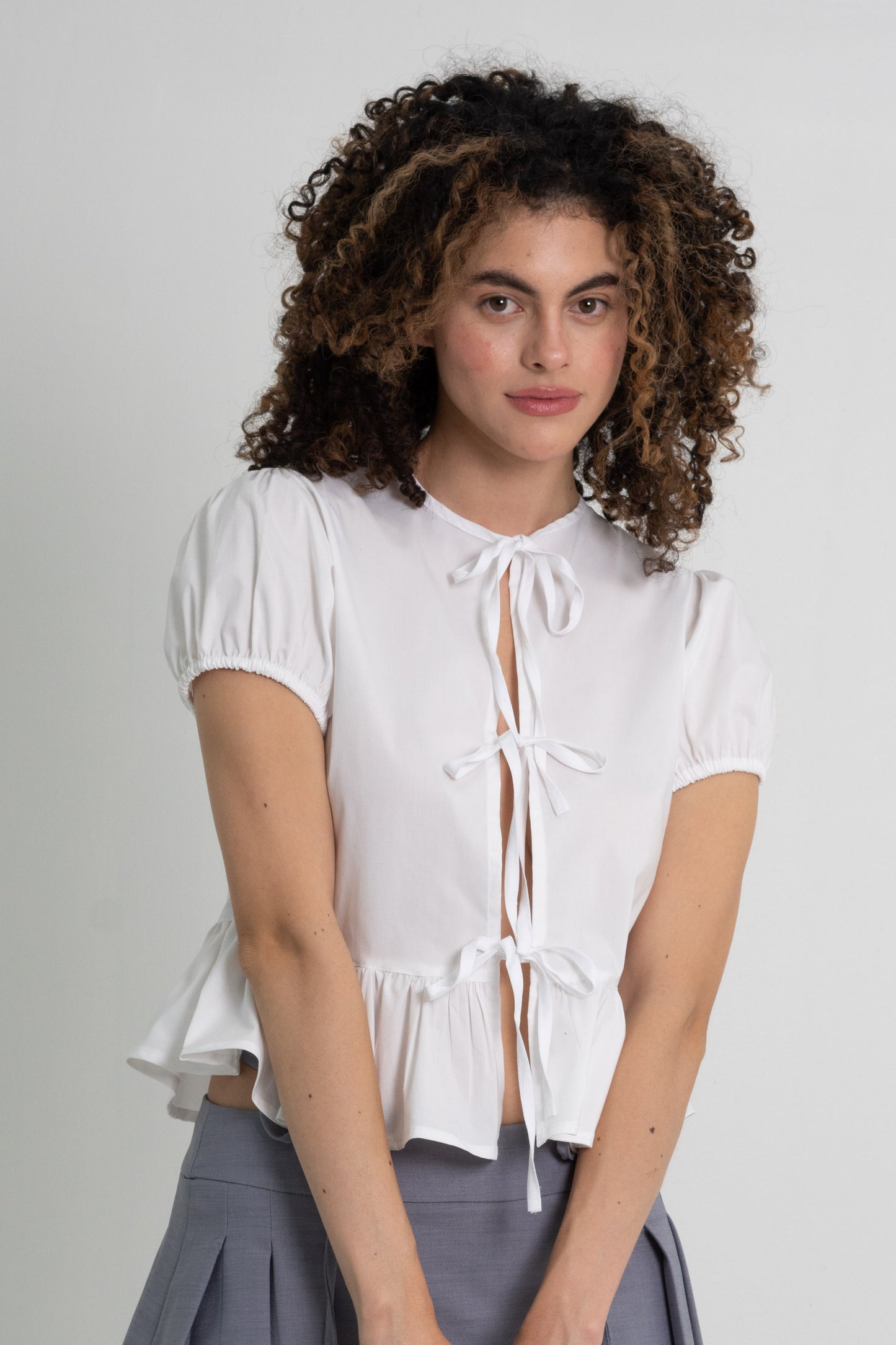 BLUSA PEPLUM LAZO COQUETTE
